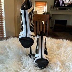 Carlos Santana black and white heeled sandals.